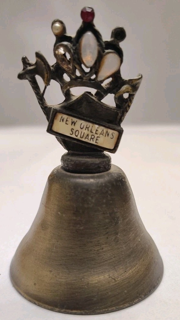 New Orleans Square Souvenir Mementos Brass Cow Bell Embellished Crown Axe Sword