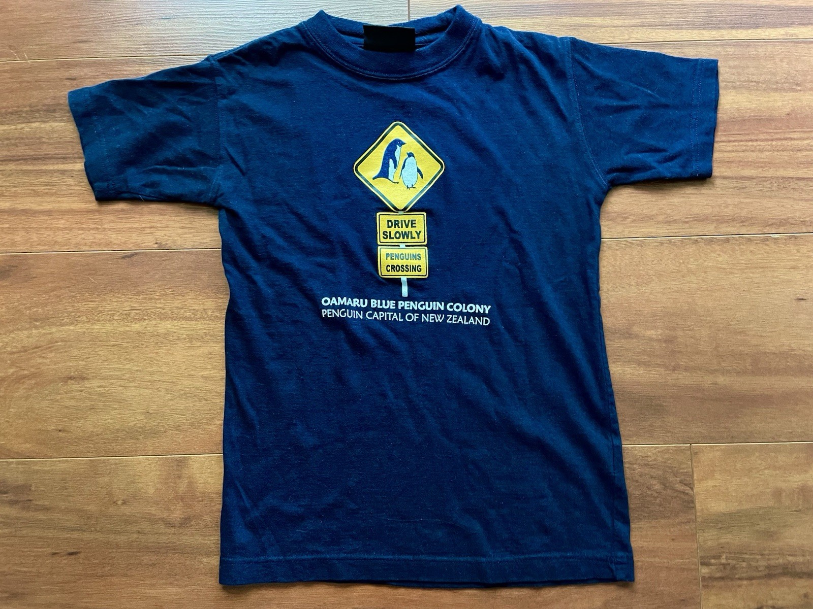 Blue Penguin T-Shirt from Oamaru New Zealand – Navy, Size 6 (US XXS)