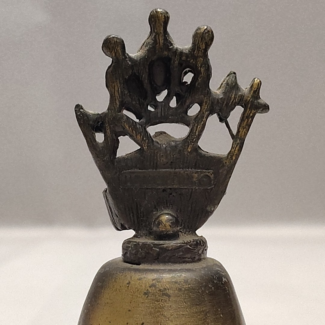 New Orleans Square Souvenir Mementos Brass Cow Bell Embellished Crown Axe Sword