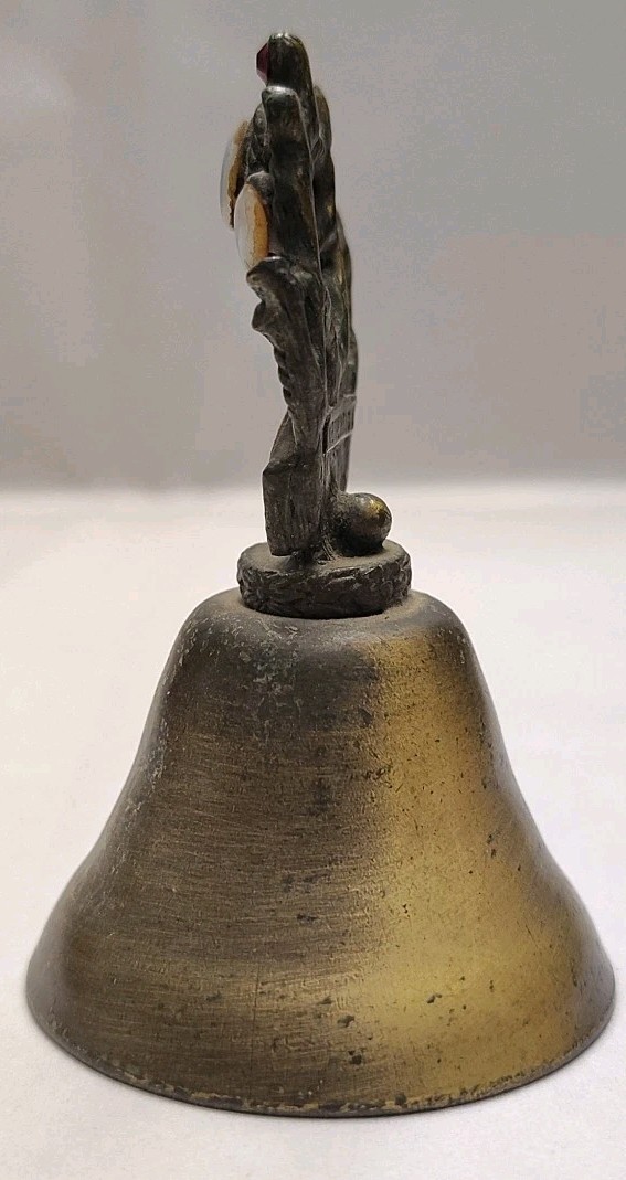 New Orleans Square Souvenir Mementos Brass Cow Bell Embellished Crown Axe Sword