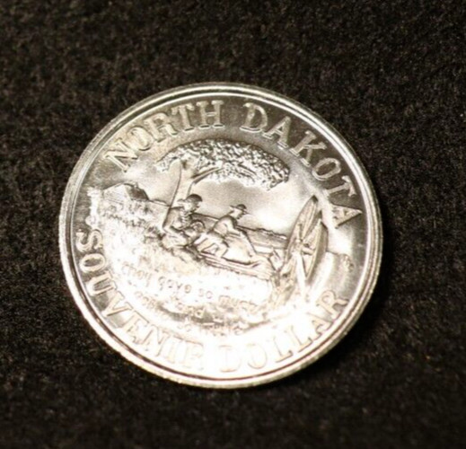 NORTH DAKOTA SOUVENIR DOLLAR 1972 BRILLIANT UNCIRCULATED MADE IN CANADA NUMBERED