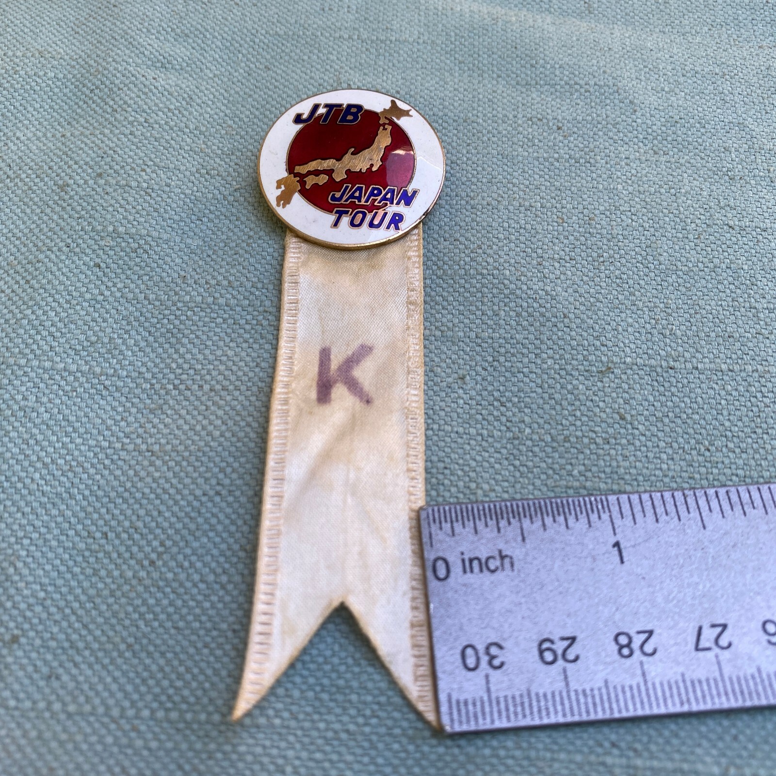 JTB Japan Travel Bureau Tour Pin Round Enameled Metal White Ribbon 1.25” Vintage