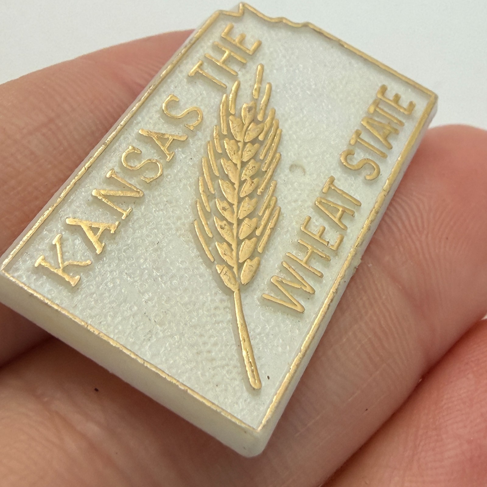 Kansas The Wheat State Map Shape Lapel Pin White Plastic Travel Tourist Souvenir