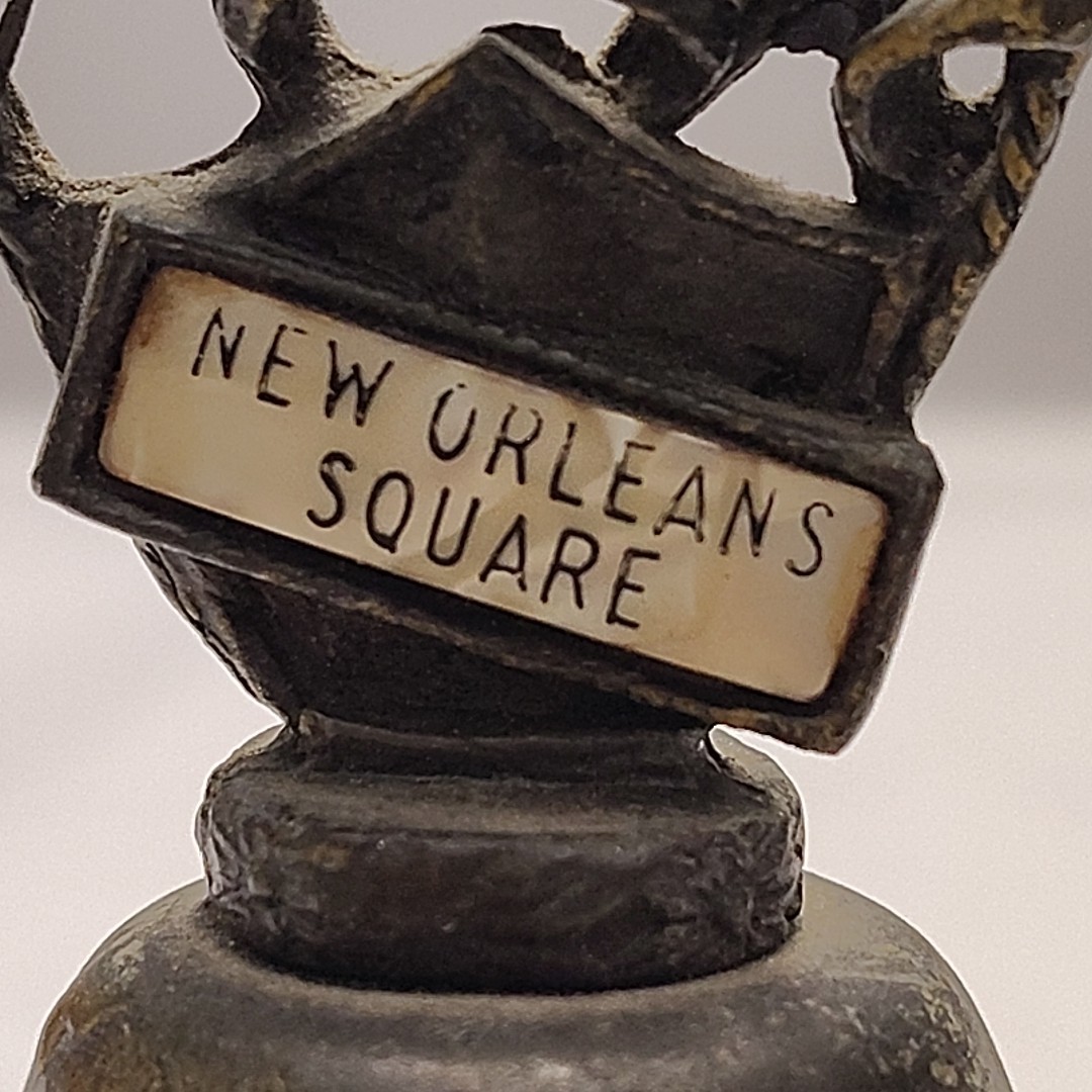New Orleans Square Souvenir Mementos Brass Cow Bell Embellished Crown Axe Sword