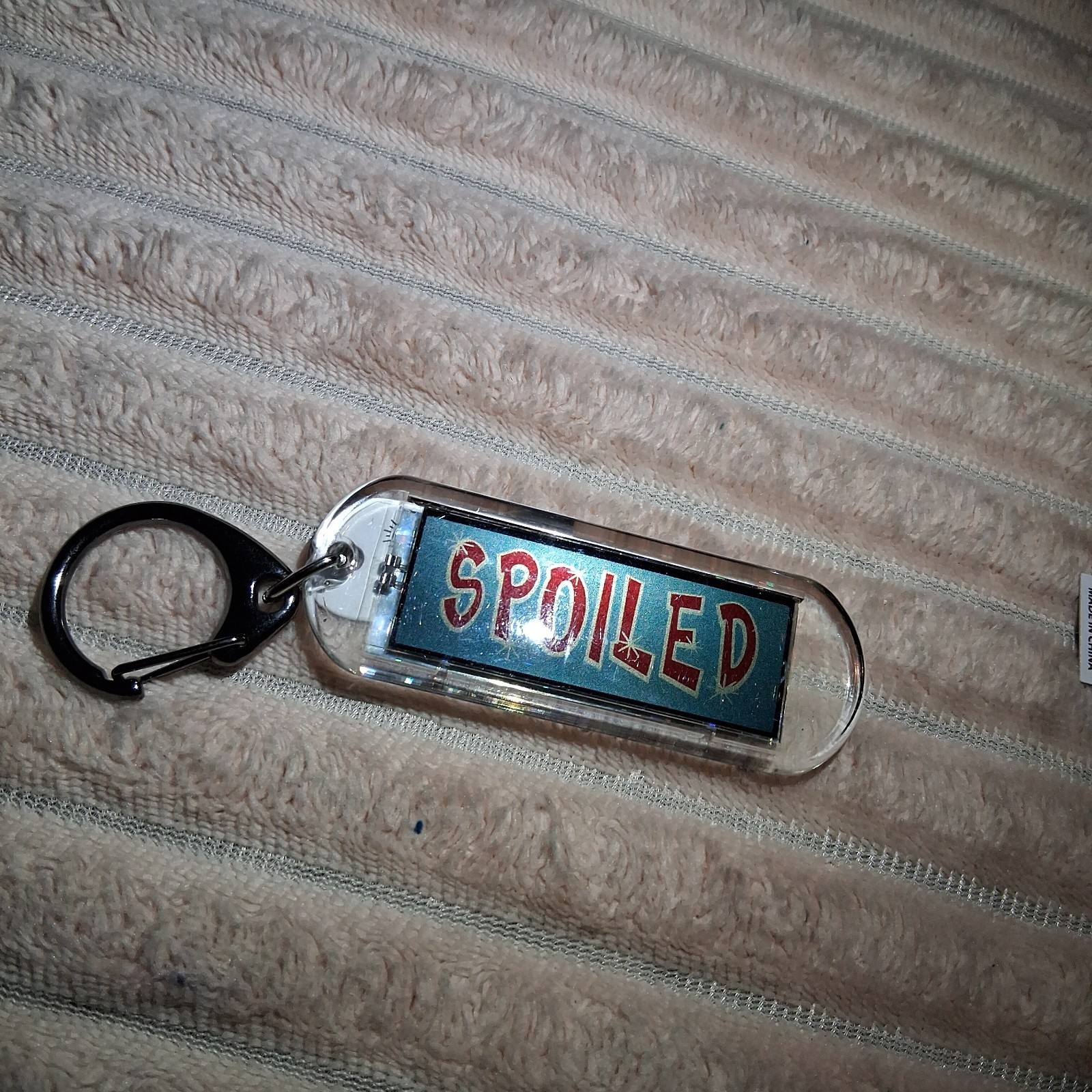 SPOILED – Acrylic Blinking Solar Powered Keychain 4.25” Long w/Snap Keyring