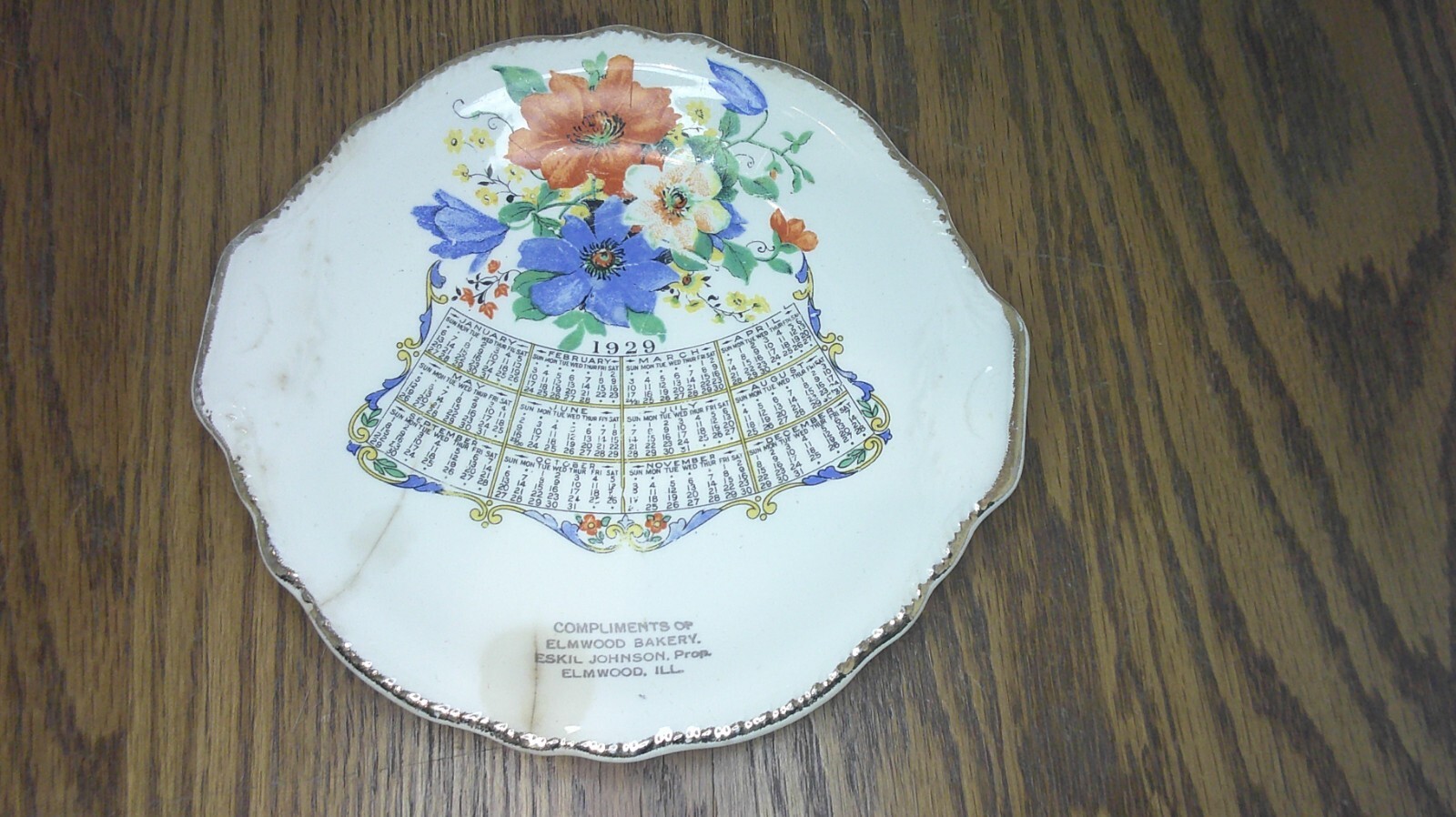 souvenir plate from Elmwood Ill. Eskil Johnson Bakery calendar plate 1929 Z87