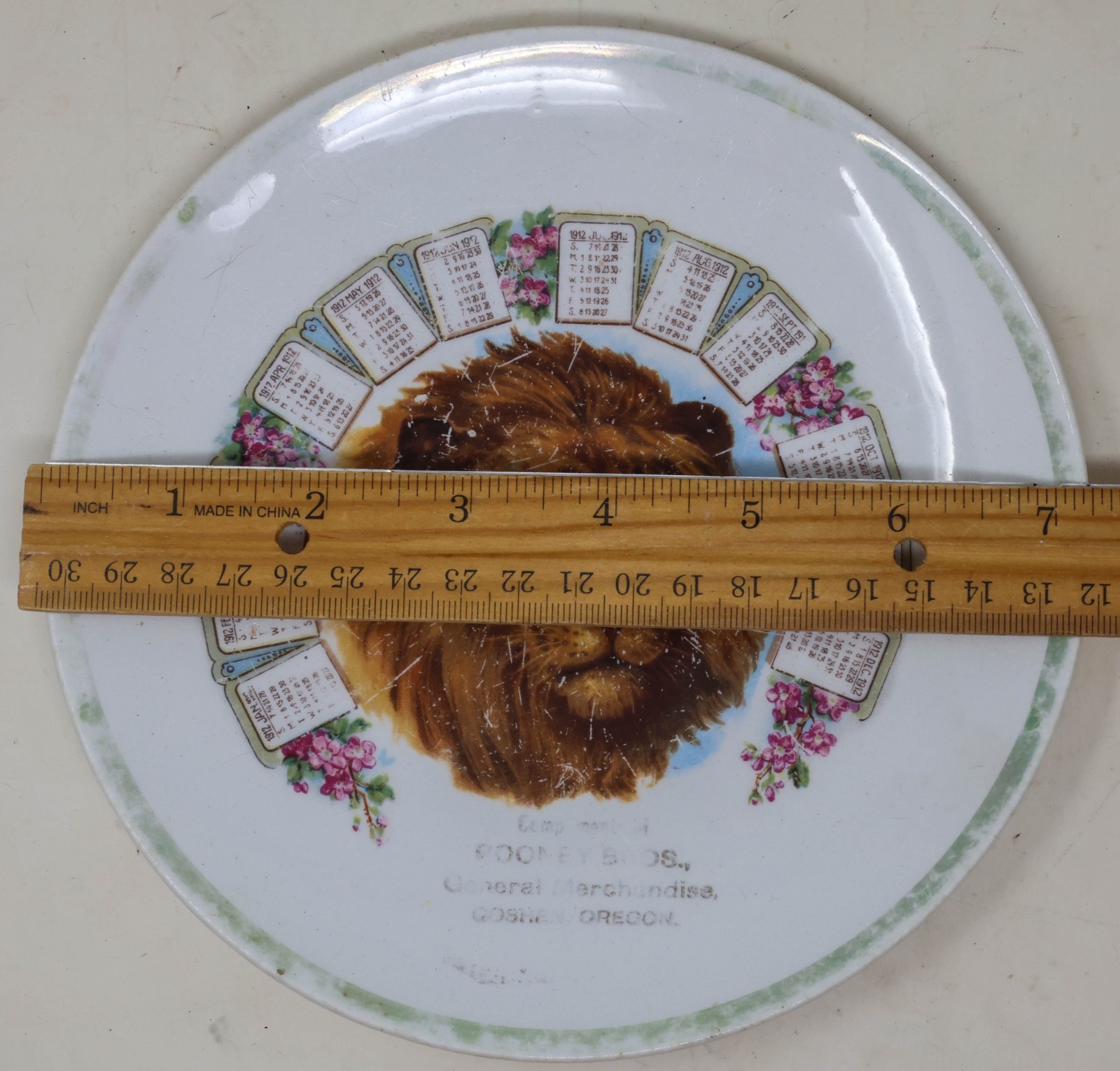 Antique 1912 Advertising Calendar Plate Goshen Oregon Lion Rooney Brothers
